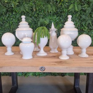 Super-Seat | Porcelain Decoration Set Elegance | White porcelain with green accents, featuring urns and vases against a background of green. | Hospitality Furniture