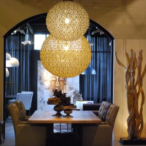 Super-Seat | Dining Room | Wooden table, upholstered chairs, XXL crystal chandelier. Warmth through bulb lighting and abstract art. | Hospitality Furniture